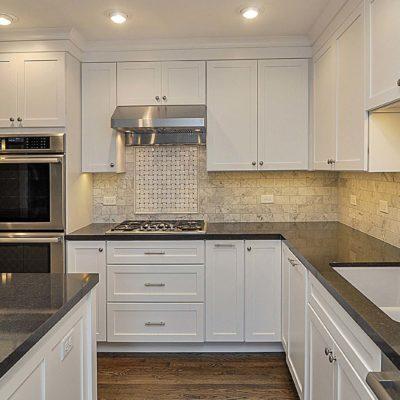 White Kitchen Black Countertops and Hardwood Floors   Gold Marble Granite & Cabinets, LLC   Baltimore